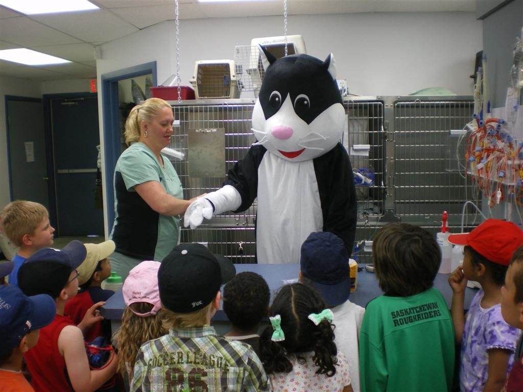 Mr Meow mascot presenting to group of children