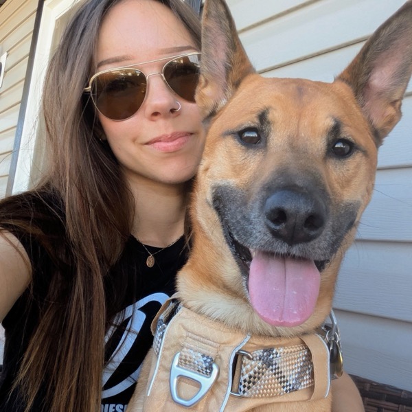 Bailey Flint, RVT, with her dog